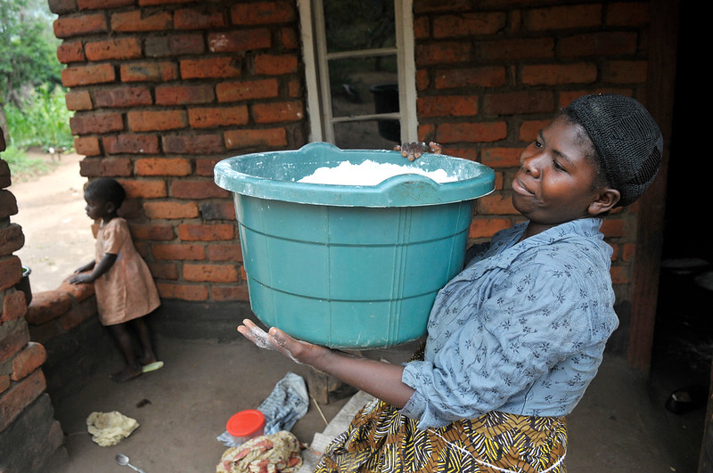 Drying maize flour in Malawi